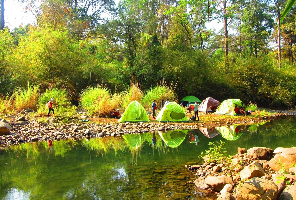 Trekkers set up tentss by Dak Ca Stream inside Bu Gia Map National Park in Binh Phuoc Province. Photo by Kieu Dinh Thap